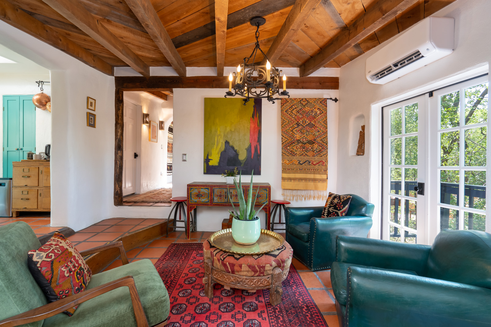 A living room with a wooden ceiling.