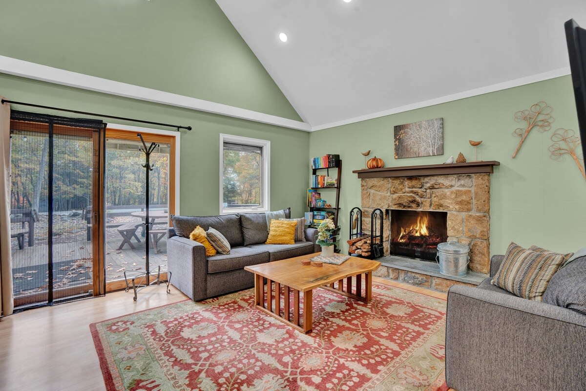 Wood burning fireplace is great for your winter retreat! Sofas are comfortable for watching TV on our 42-in smart TV (adjustable angle) or choose a board game, puzzle, or book from our collection. Large sofa also pulls out into a queen bed.