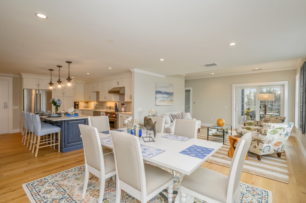 Open Concept Dining/ living area with seating for 6. Entrance to private outdoor patio.