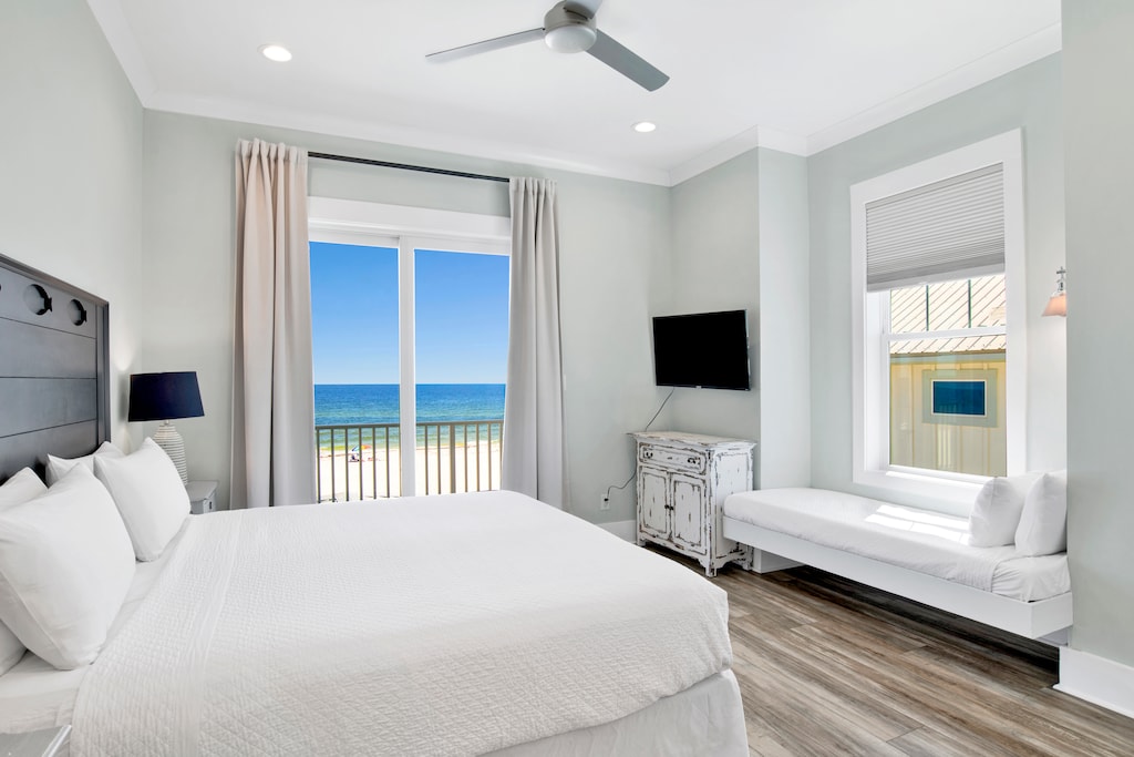 The guest bedroom, located on the 2nd floor with a private bathroom, King bed, Twin bed, TV and balcony access