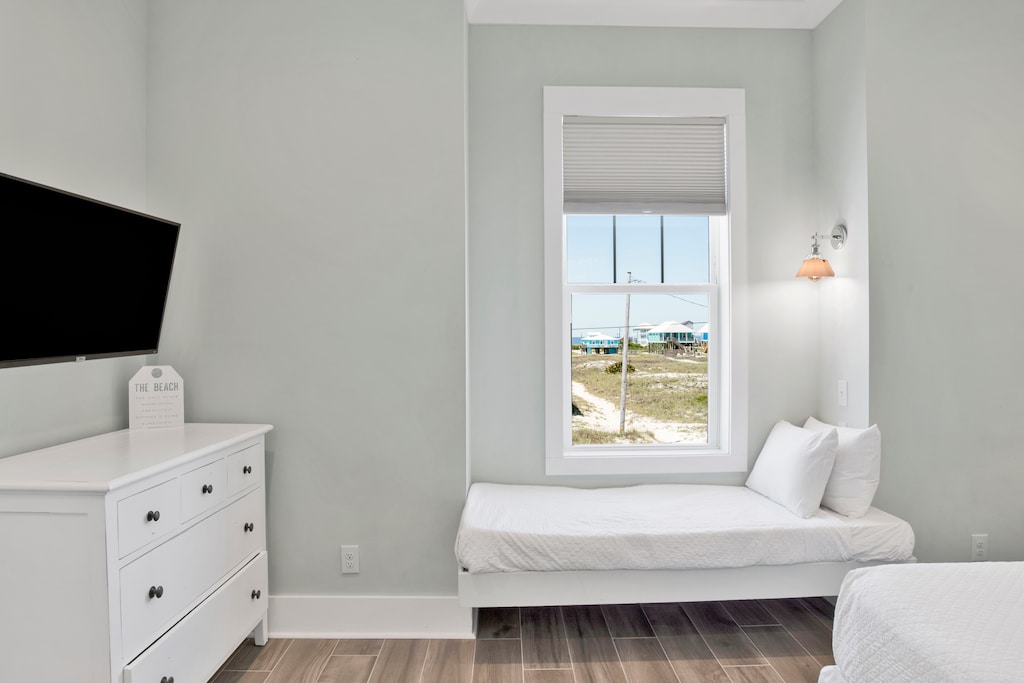 The guest bedroom offers a King bed, Twin bed and TV