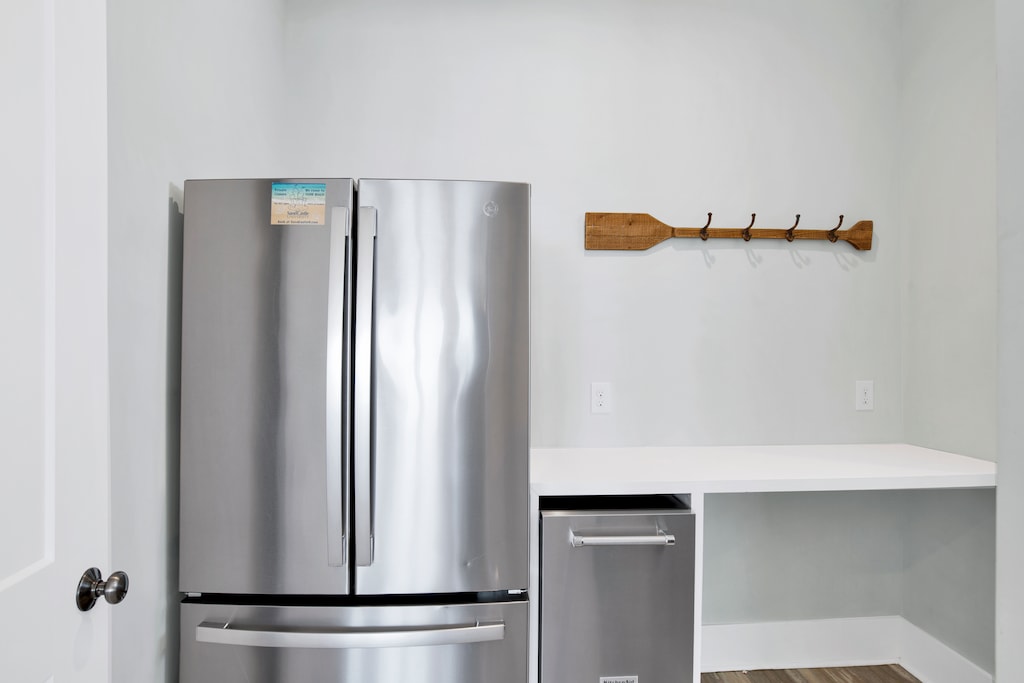 Features a standalone ice maker and full size fridge