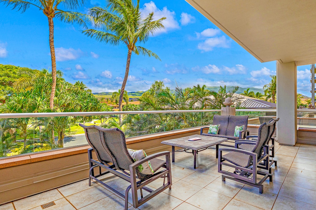 Unwind on the spacious lanai at Honua Kai Konea 232 with cozy seating and scenic island views.