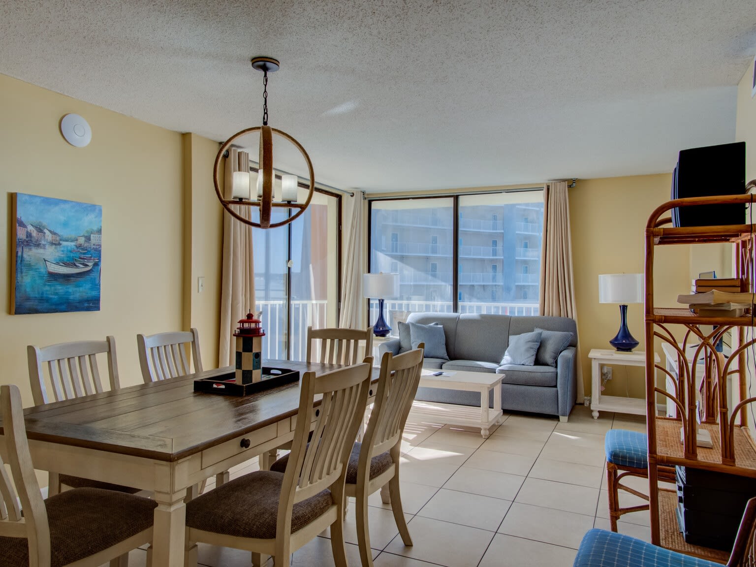 Dining area with living area in the background & balcony access