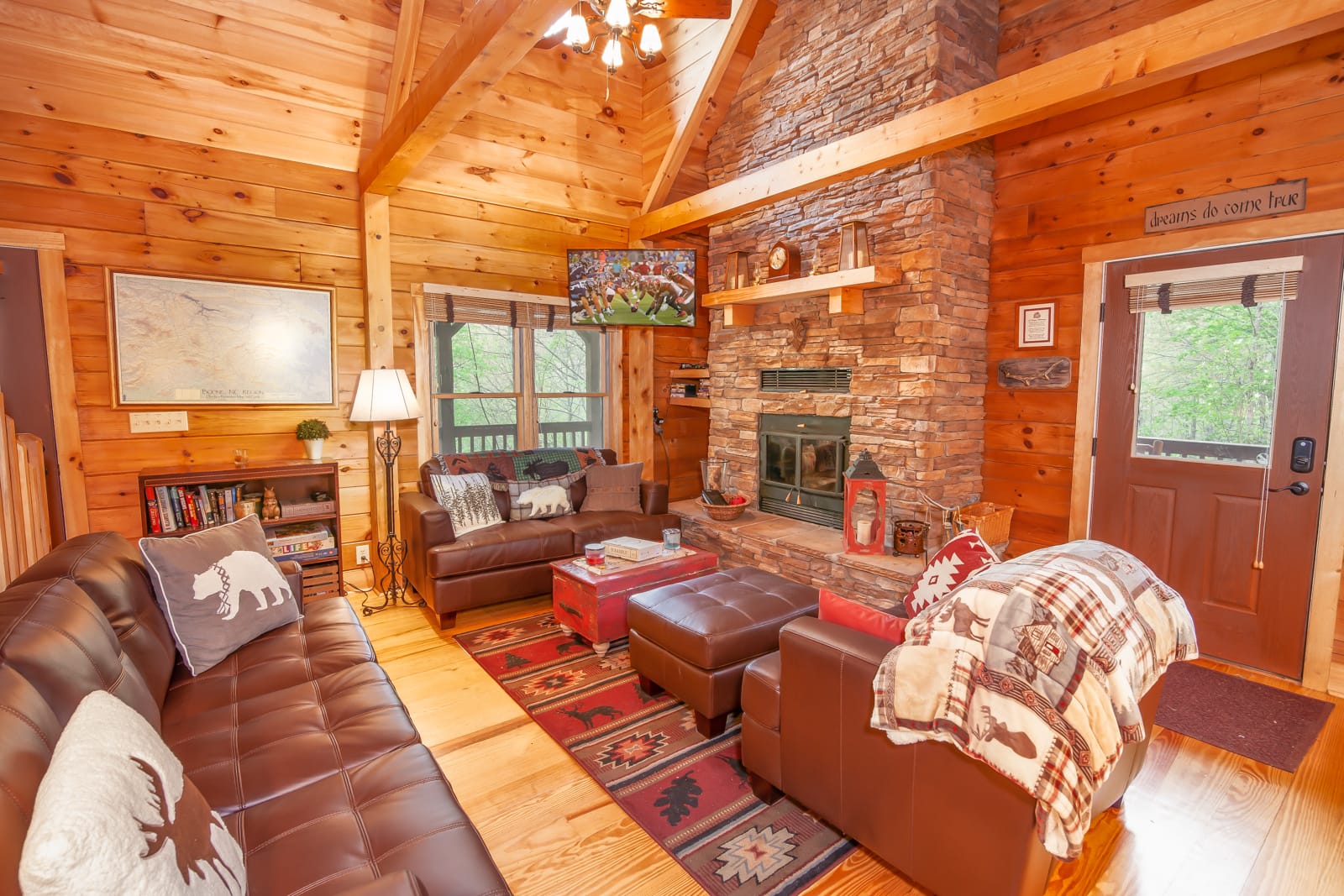 Great Room with Floor-to-Ceiling Stacked Stone Wood Burning Fireplace