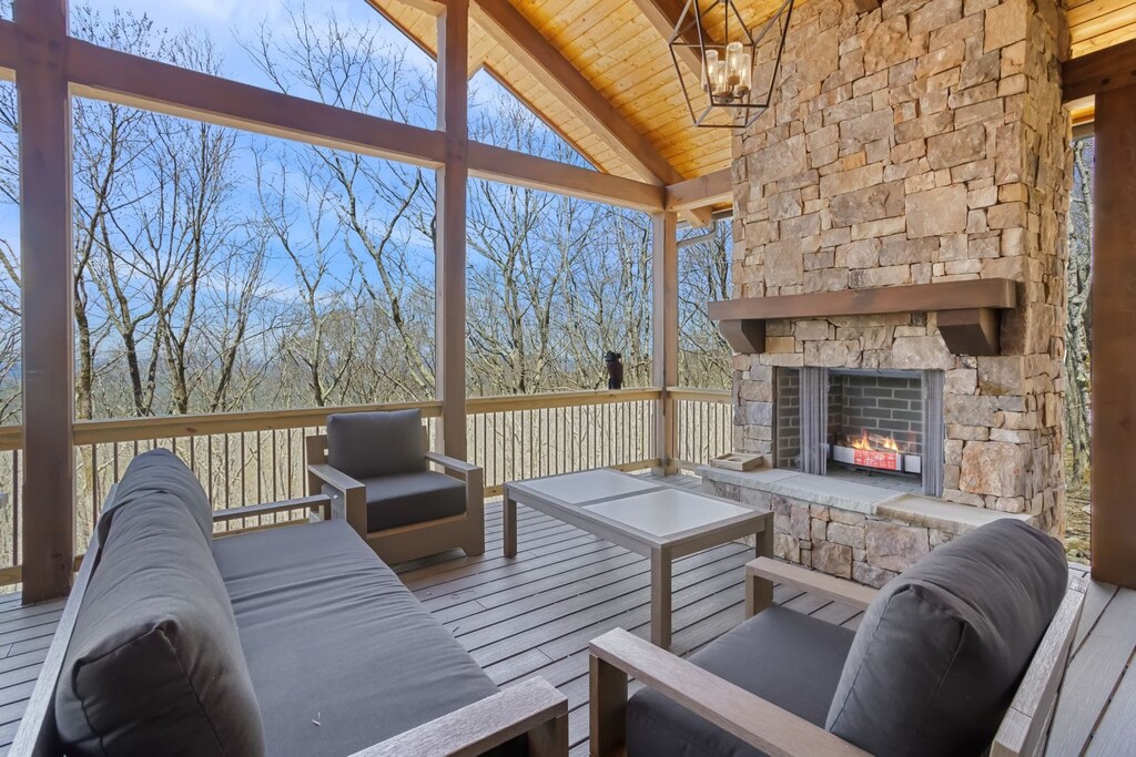 Outdoor Living Space with Stacked Stone Wood Burning Fireplace