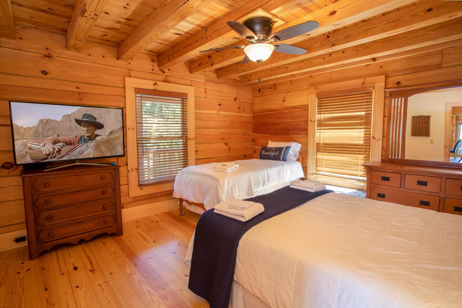 Main Floor Bedroom with Large HDTV