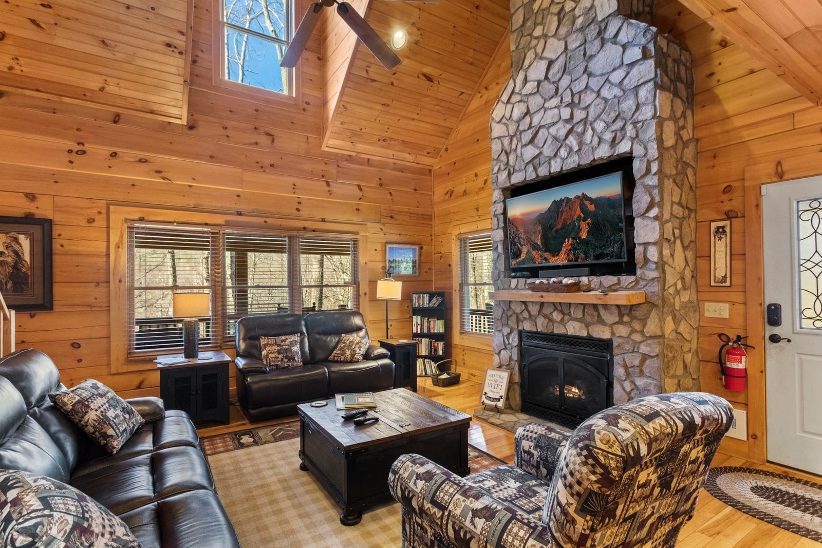 Living Room with Stacked Stone Gas Fireplace, Leather Furniture and Vaulted Tongue and Groove Ceiling