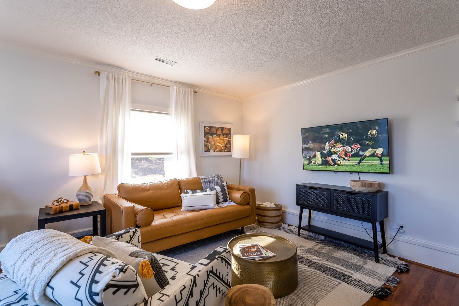 Upscale Condo with TV and Leather Sofa