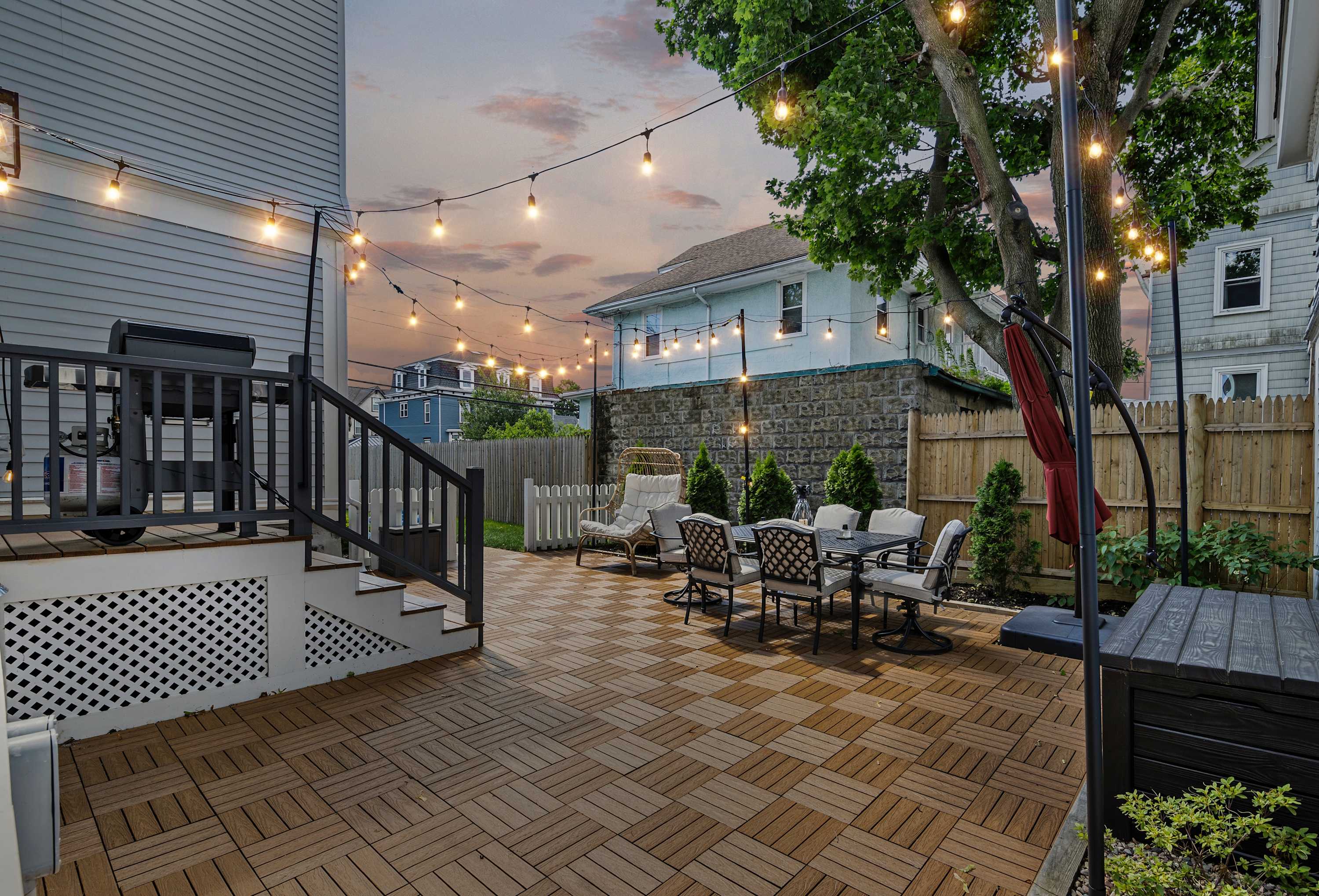 Enjoy magical evenings on our outdoor patio, illuminated by the warm glow of string lights - your home away from home!