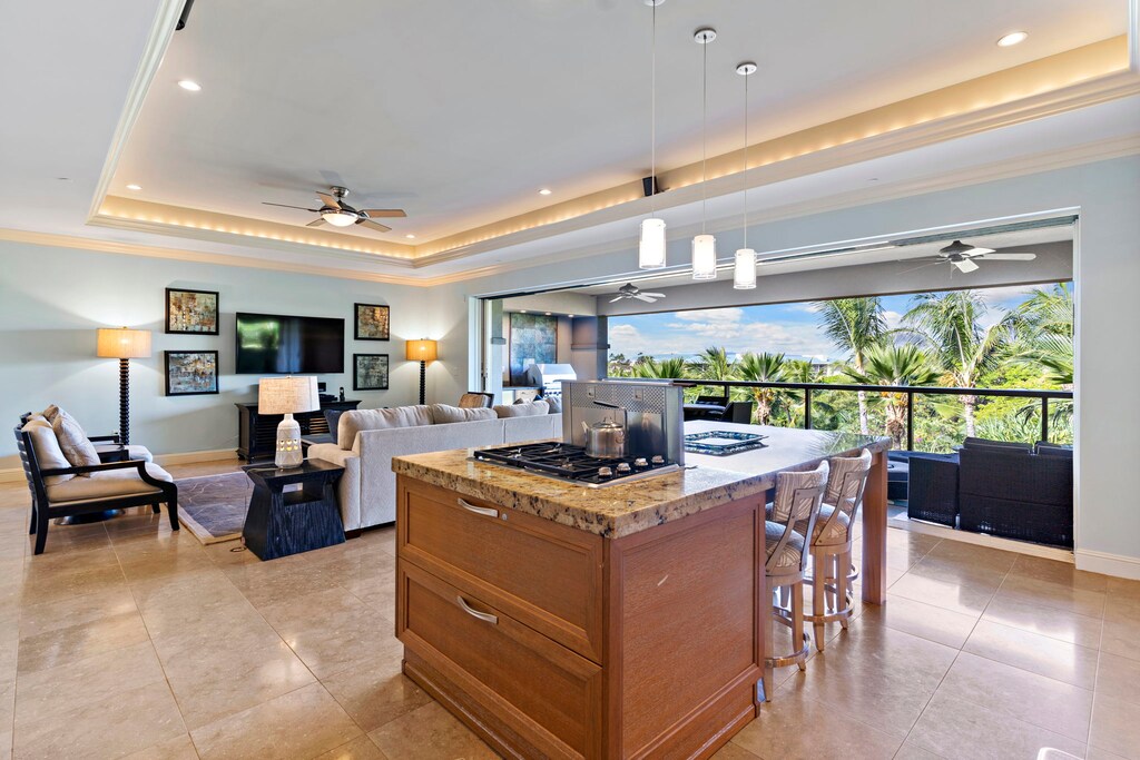 Wailea Hoolei 93-3 features an open kitchen, cozy living space, and lanai with tropical views.