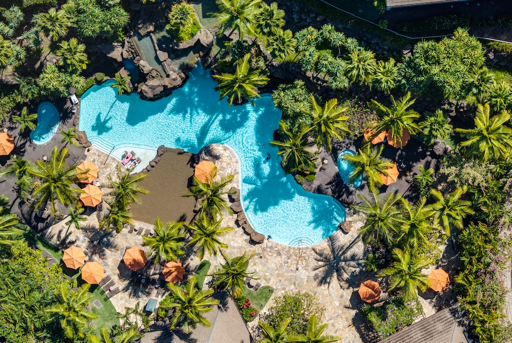 Bird's-eye view of the Wailea Hoolei Resort pool, surrounded by lush landscaping and serene beauty.