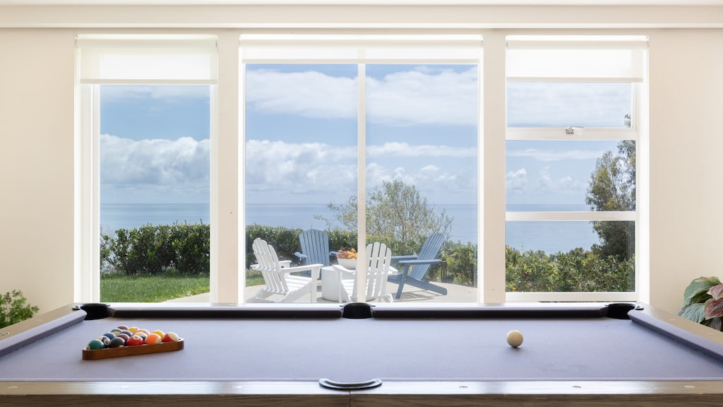 Socialize in the game room with a pool table and large flat-screen TV.