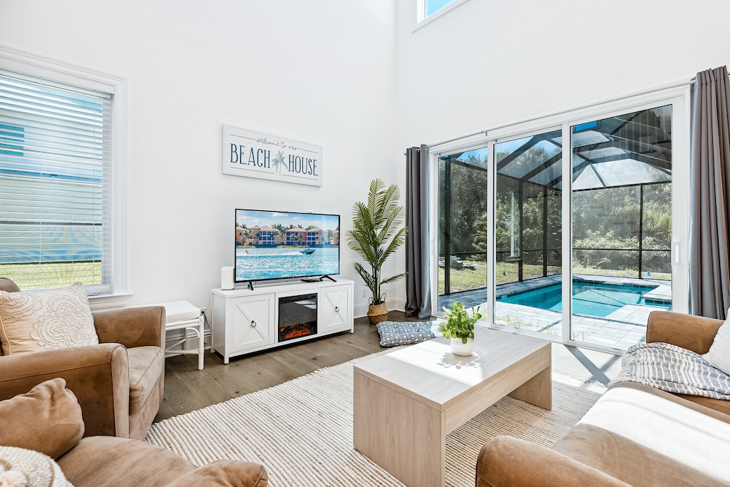 Cozy living room with a great view and easy access to your private pool!
