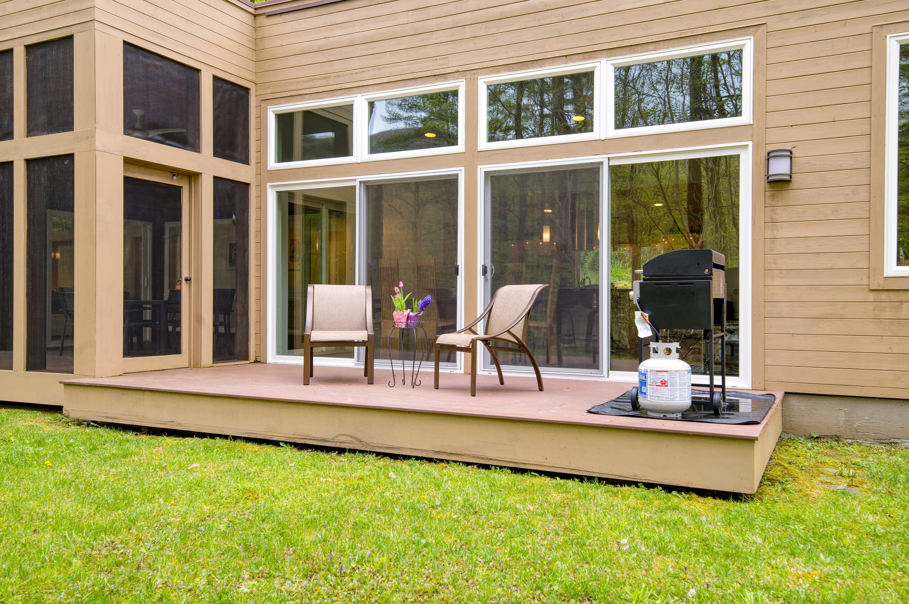 Step onto your spacious deck with comfortable seating and a BBQ grill.