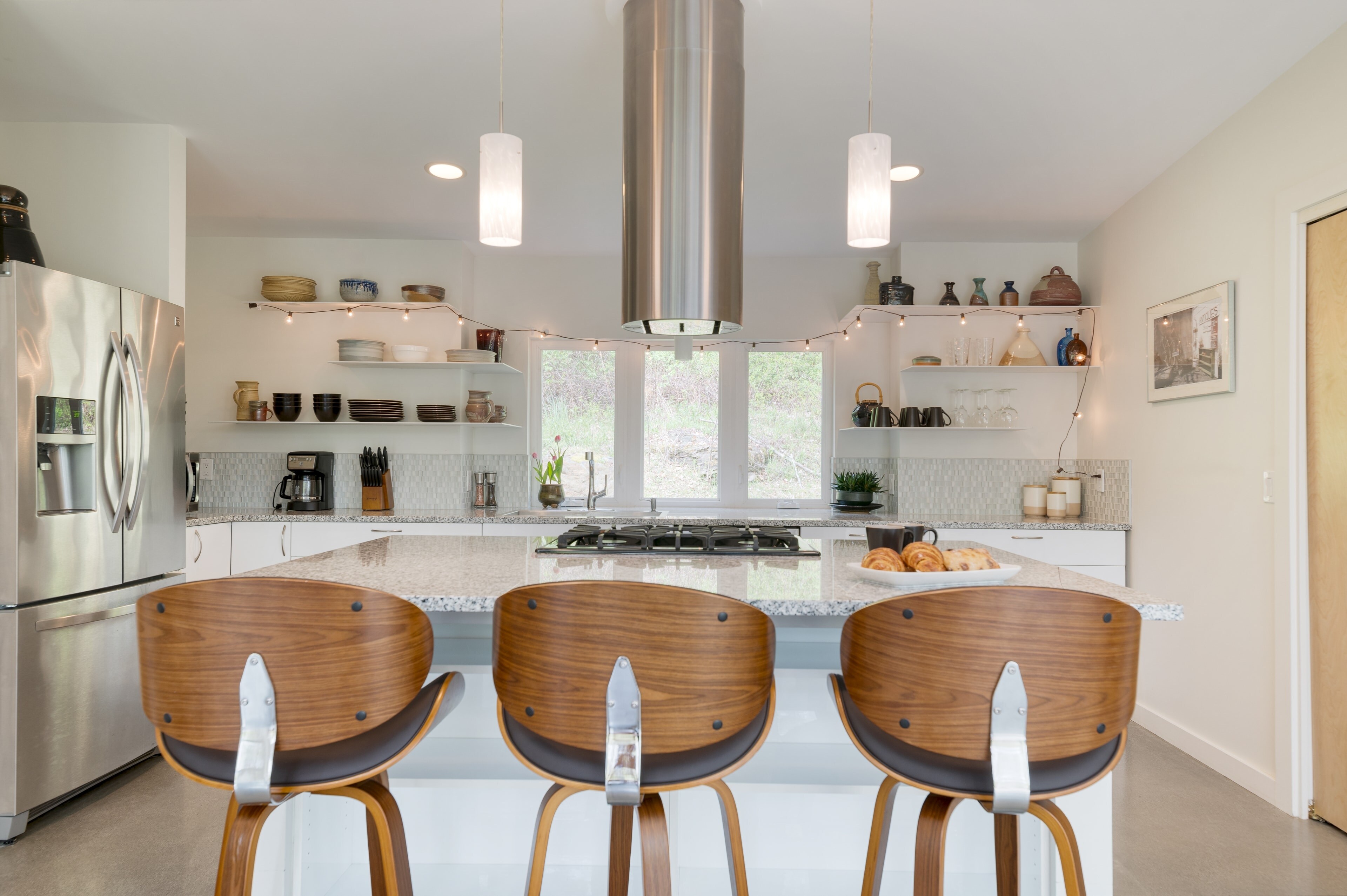 Kitchen barstool seating ensures everyone can gather comfortably.