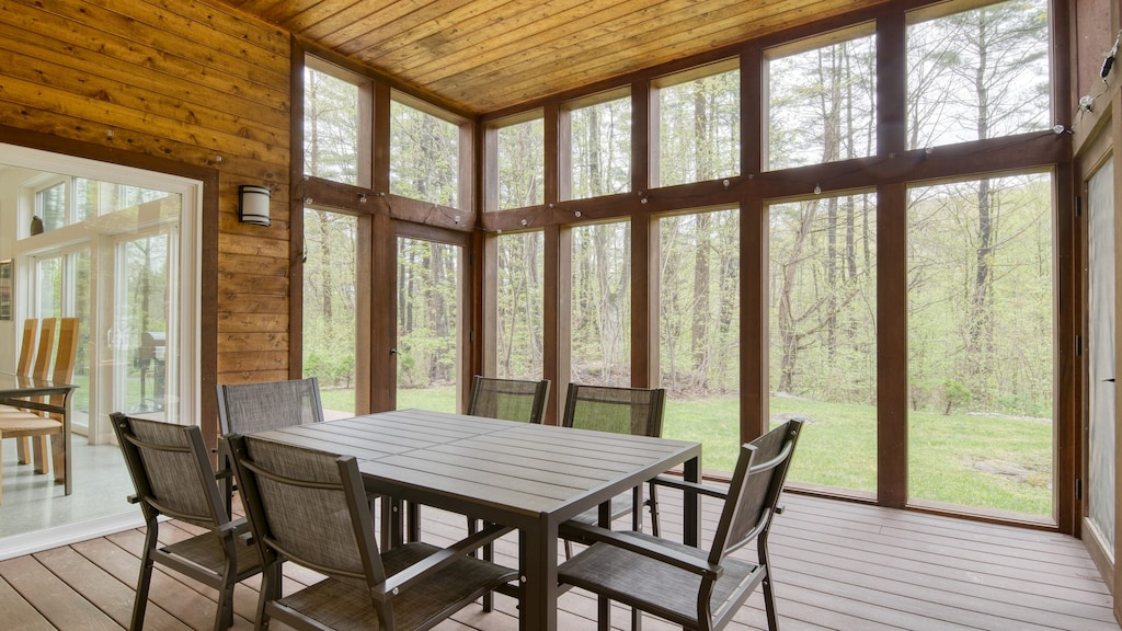 The sunroom dining table offers additional seating for guests.