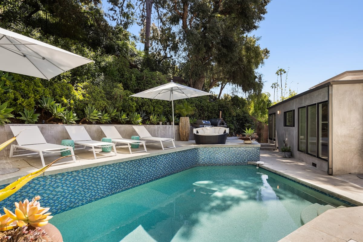 Refresh and unwind under the California sun in the tranquil oasis of the pool at the Beverly Hills Canyon Villa.