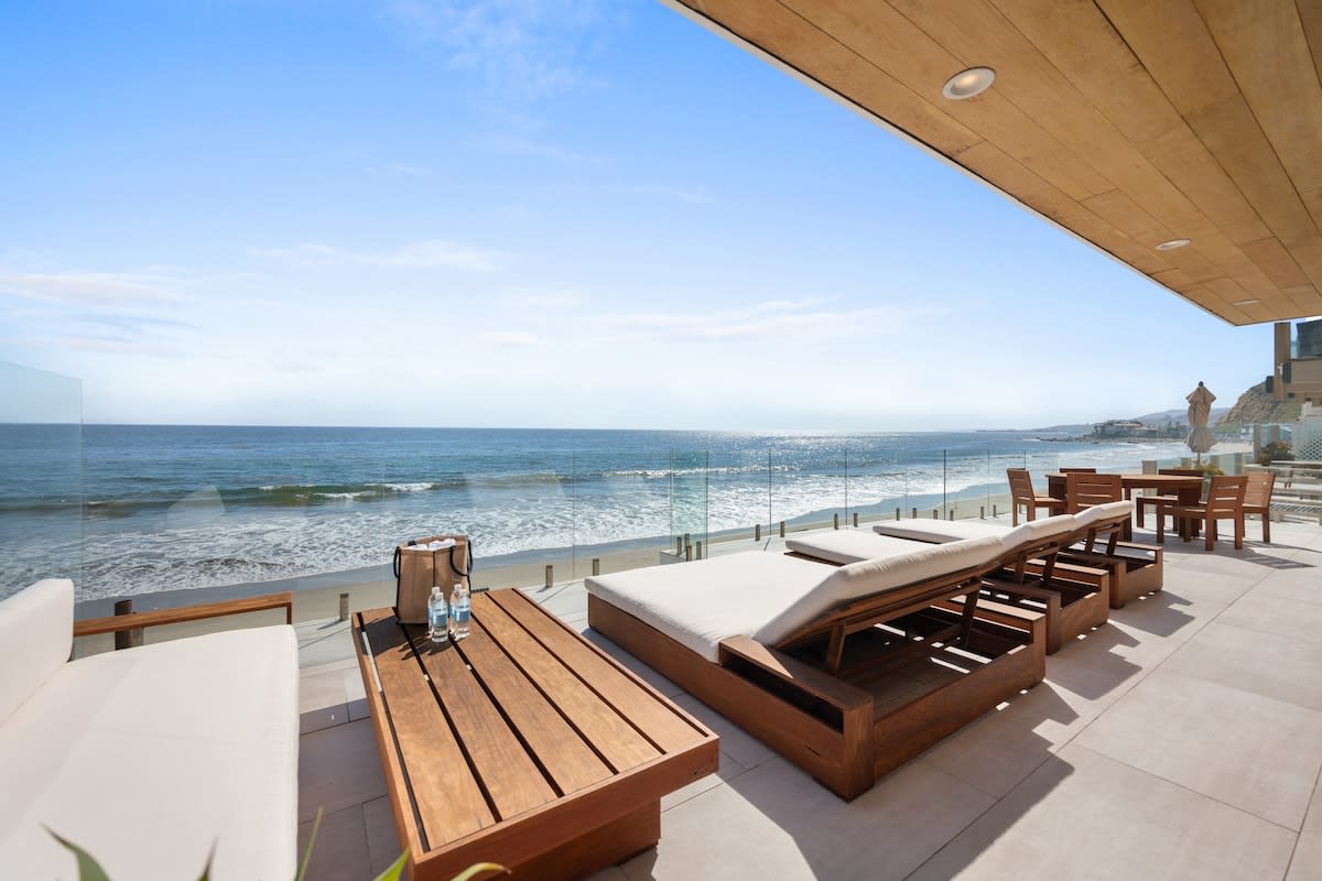 Expansive beachfront deck with unparalleled panoramic views of the ocean coastline.