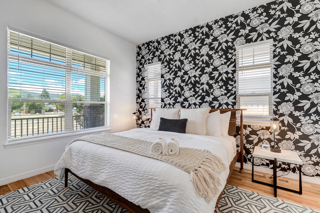 Enjoy the master bedroom with a comfortable bed, stylish decor, and plenty of natural light..