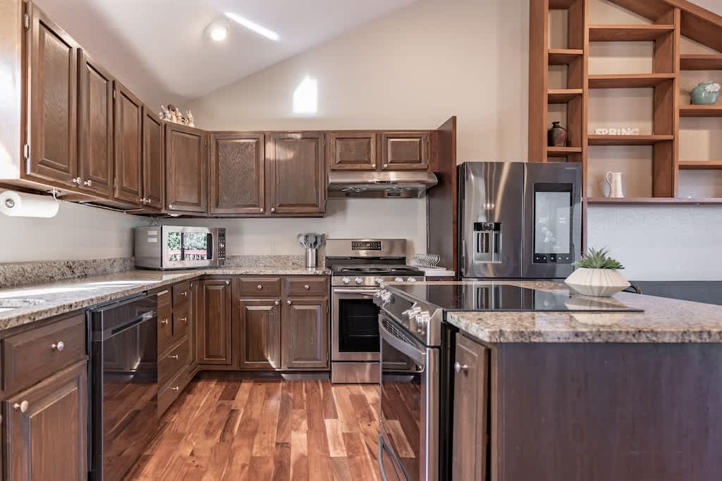 Warm and inviting kitchen featuring rich brown wood interiors that create a cozy cooking haven.