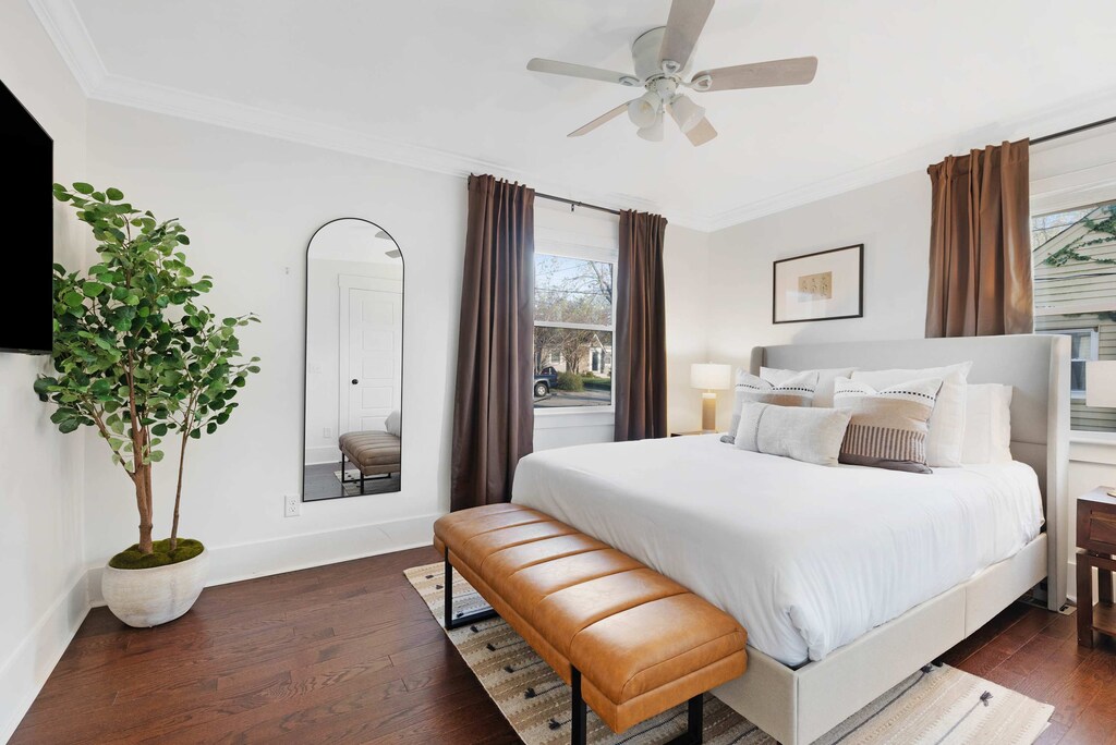 Bright and cozy king bedroom with stylish décor and natural light