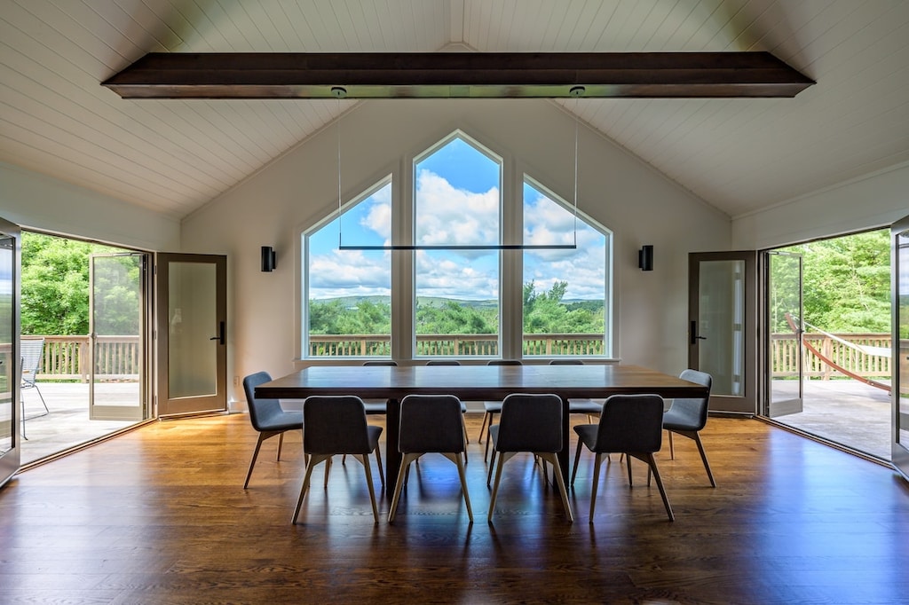 A large dining table and picture windows make for a perfect place to dine and celebrate