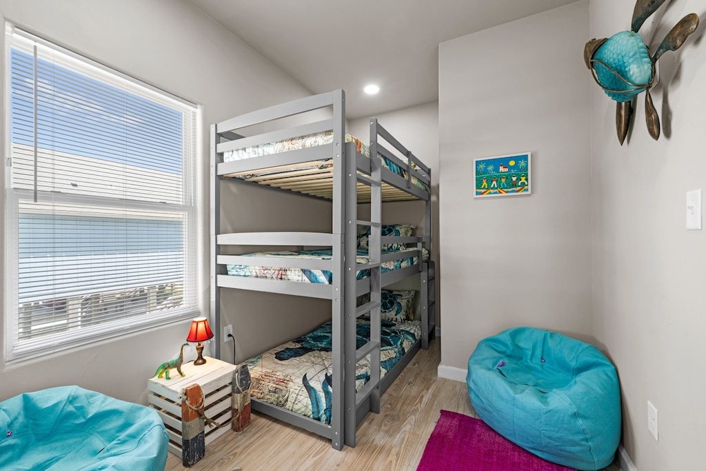 Bedroom 3 features a triple twin bunk bed.