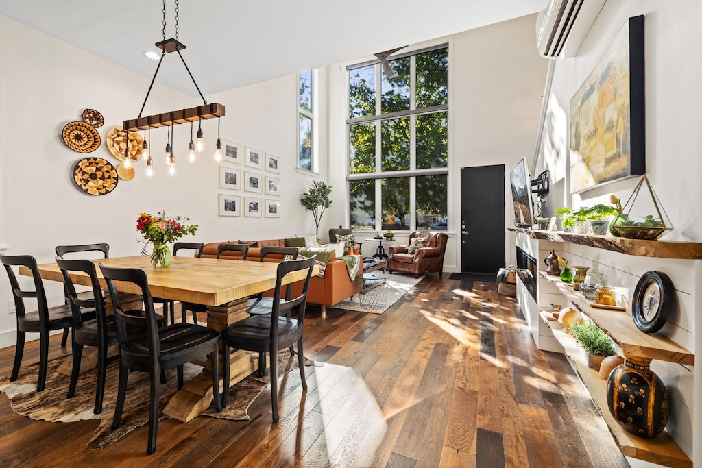 This space features plush seating, a large Smart TV, and a dining table for eight.