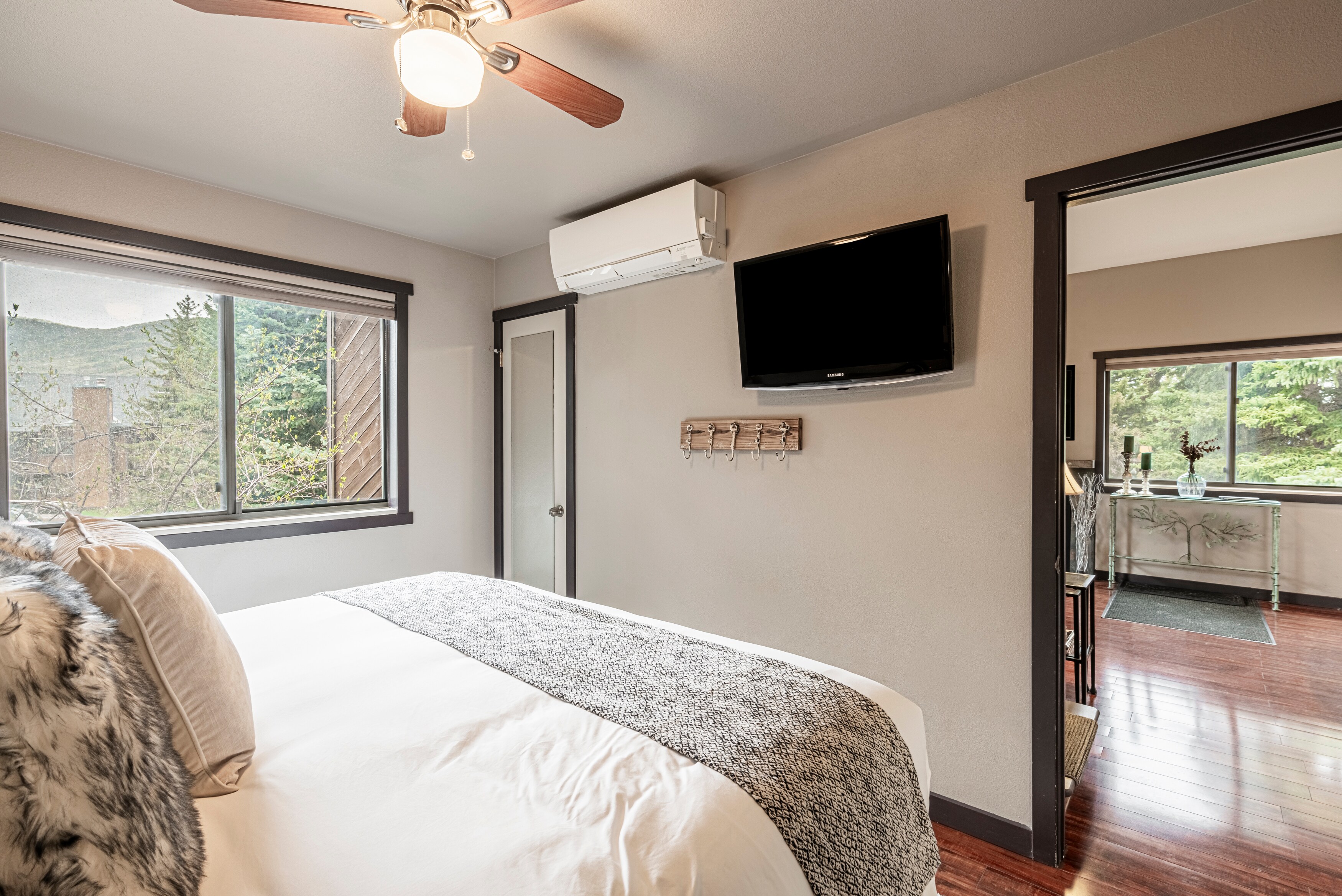 Master bedroom with a king bed, Samsung TV with cable, split heat / AC wall mount system