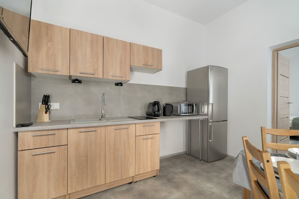 Kitchenette with fridge and freezer.