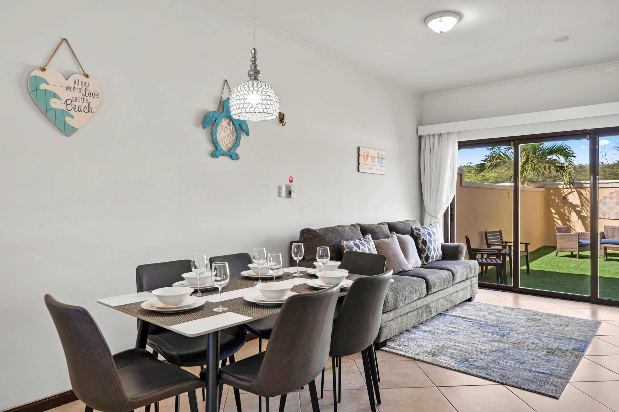 Living room with access to the backyard with glass sliding doors