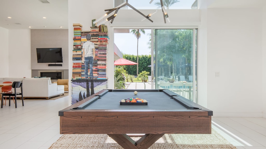 The upscale, luxe interior boasts plenty of ways to keep your group entertained, including a pool table surrounded by natural light.