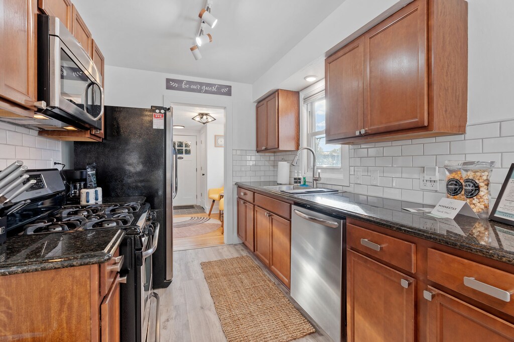 Cook your favorite meals in this fully equipped kitchen with granite countertops, stainless steel appliances, and everything you need for a perfect stay.