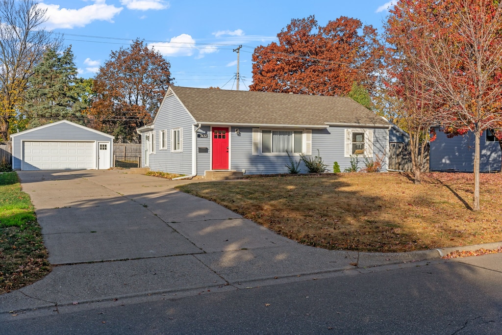Charming ranch-style home with vibrant red door sits on quiet residential street, surrounded by beautiful autumn foliage and mature trees.