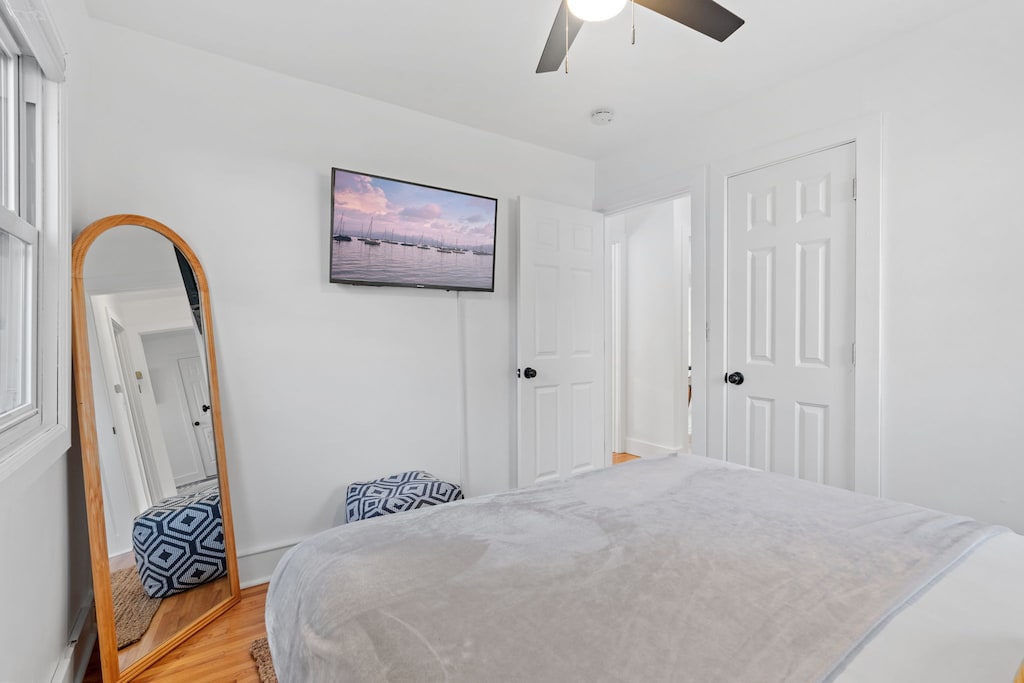 Relax in your bright, airy bedroom with crisp linens, a large mirror for getting ready, and a mounted TV for unwinding after exploring.