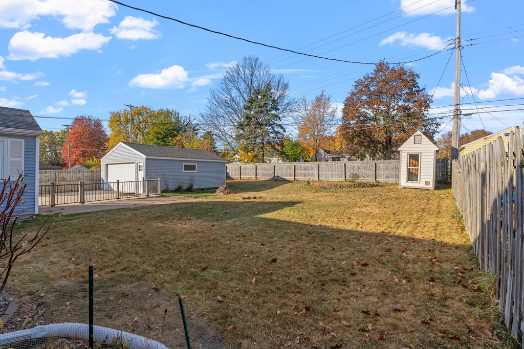 Spacious fenced backyard with autumn foliage offers privacy and room to relax in this quiet residential neighborhood.