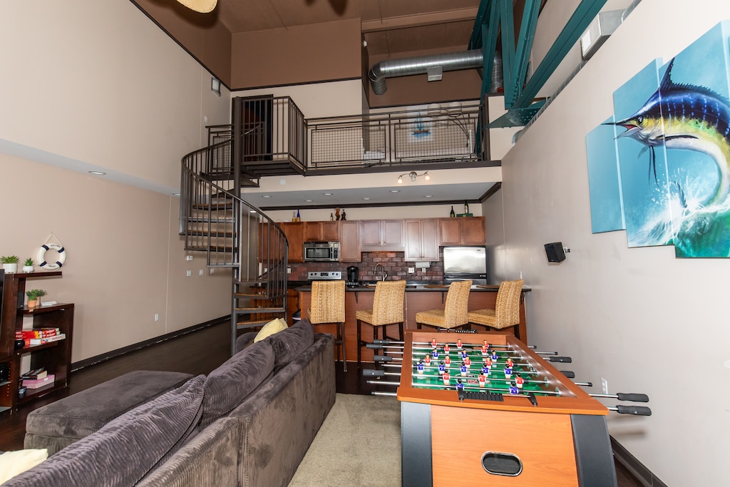 Unwind in your stylish loft with soaring ceilings, full kitchen, and foosball table for evening entertainment.