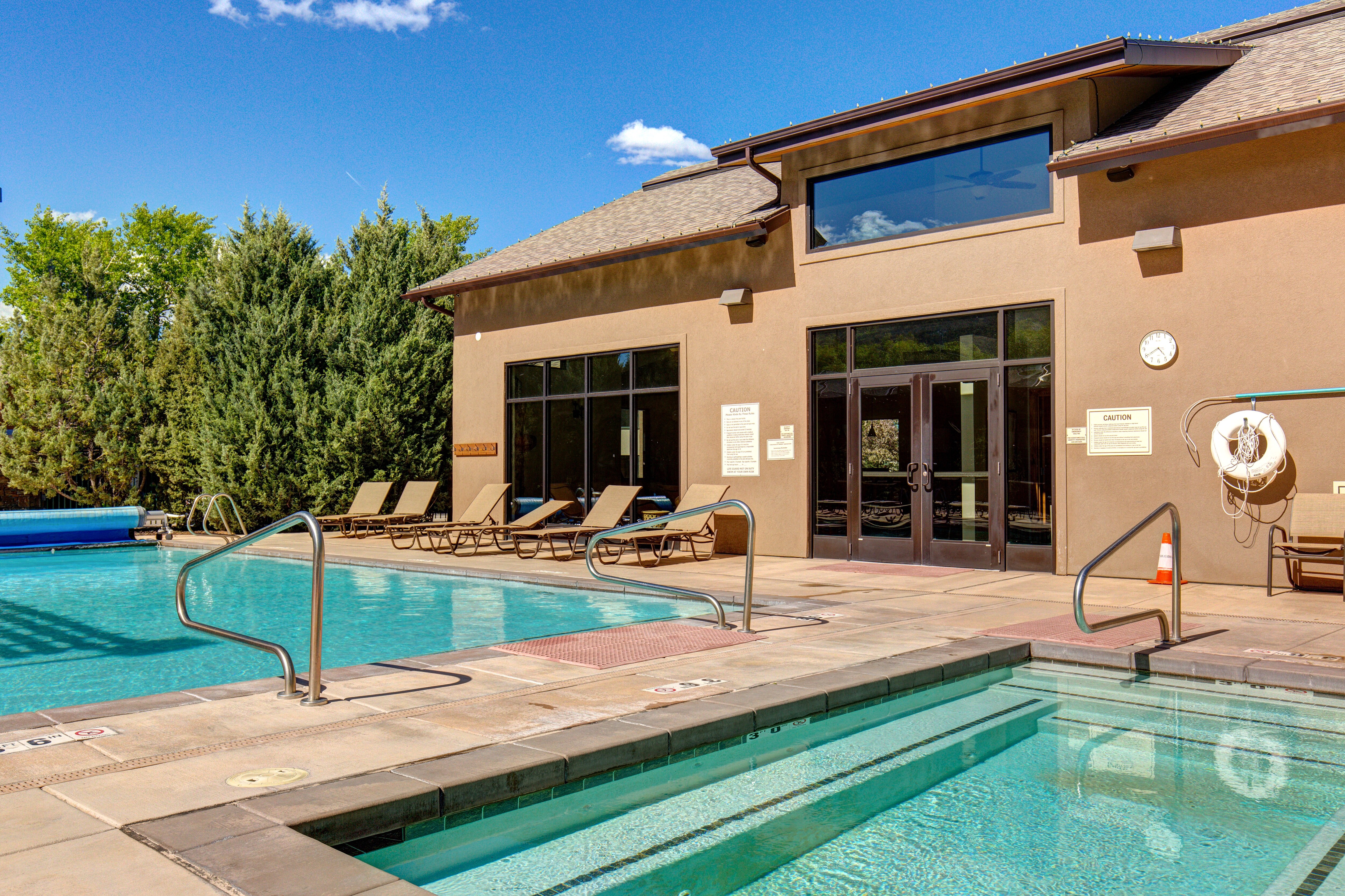 Community Clubhouse with a heated pool and two hot tubs