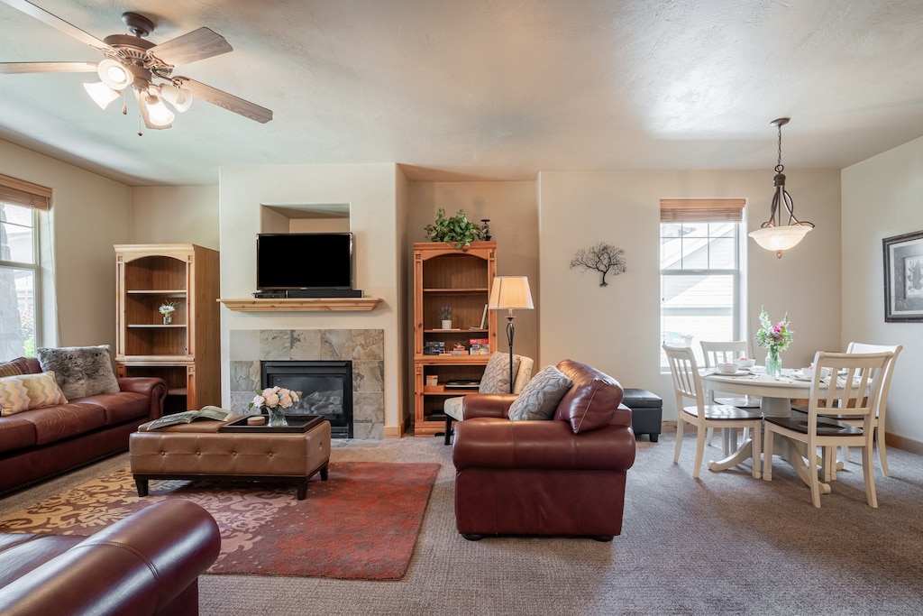 Living space filled with light from windows and lamps