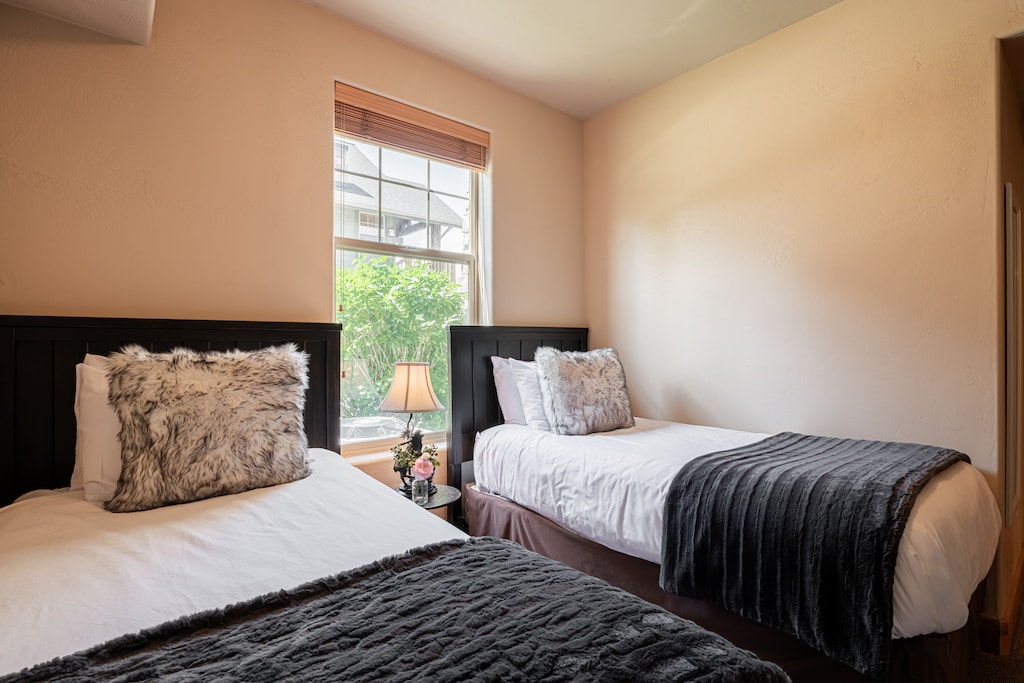 With natural light and clothing storage space in dresser and closet