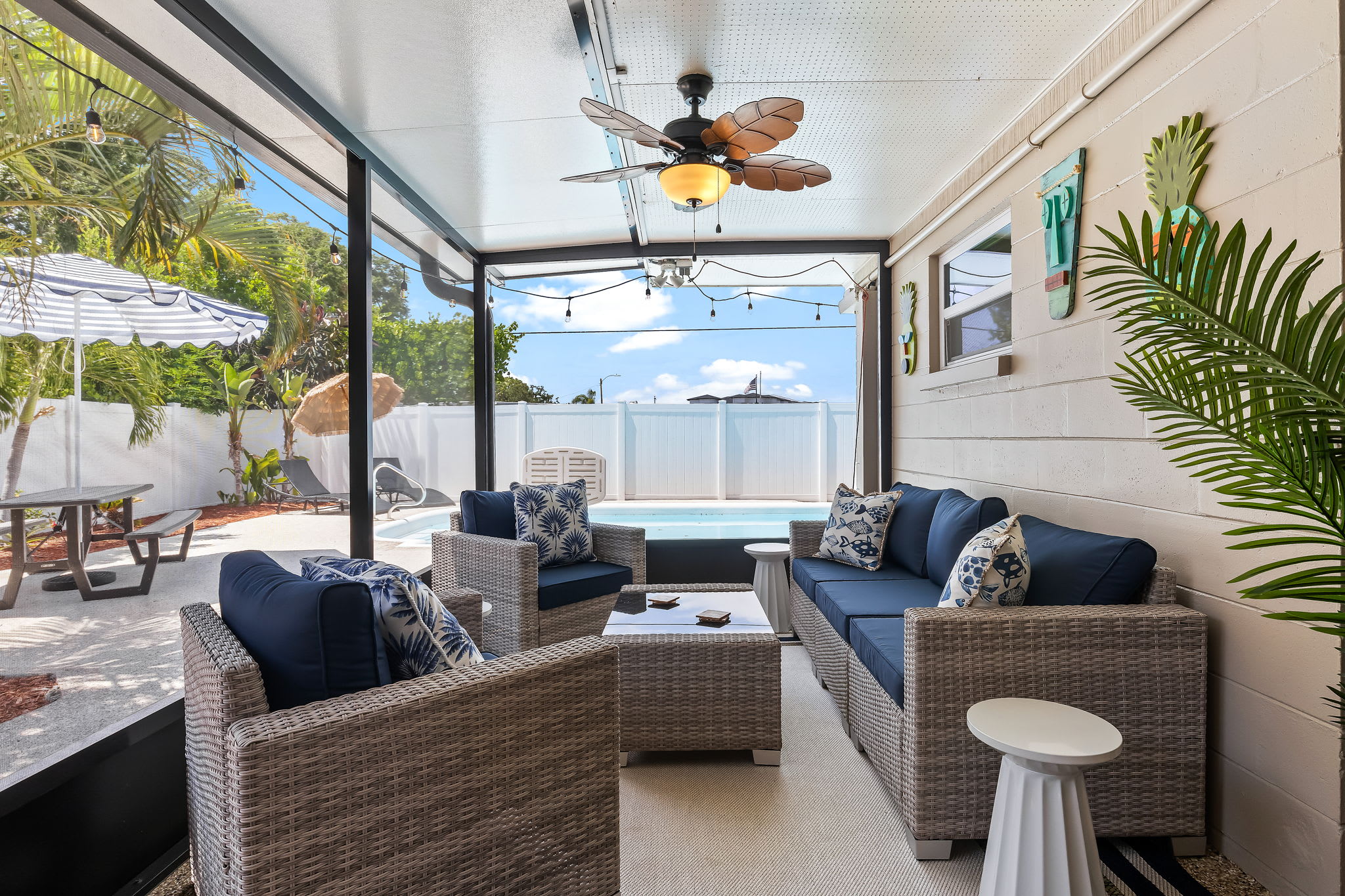 Relax on the outdoor patio with stunning views of the sparkling pool.
