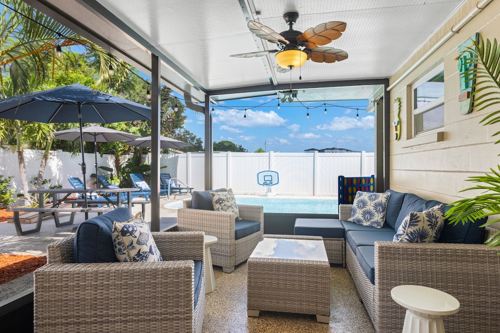 Relax on the outdoor patio with stunning views of the sparkling pool.