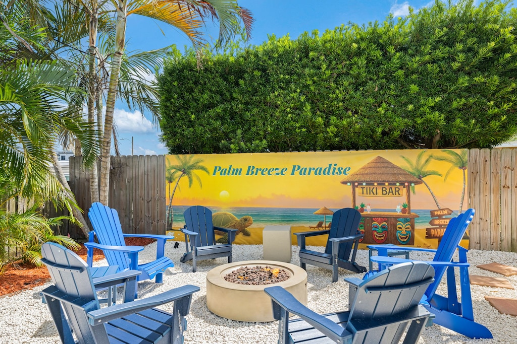 Gather around the firepit in your own tropical backyard paradise.