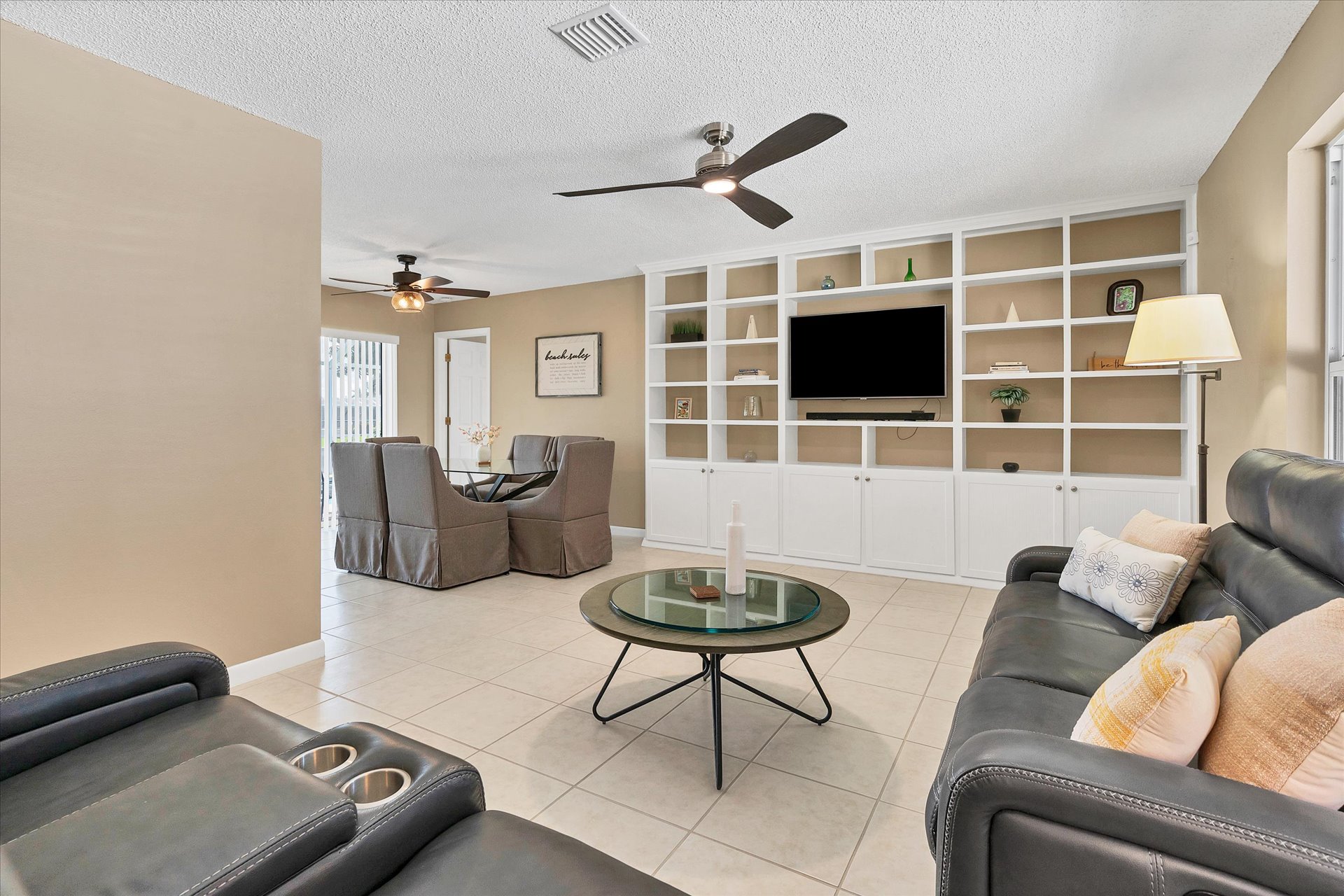 Bright living room with ample seating and 50-inch Smart TV