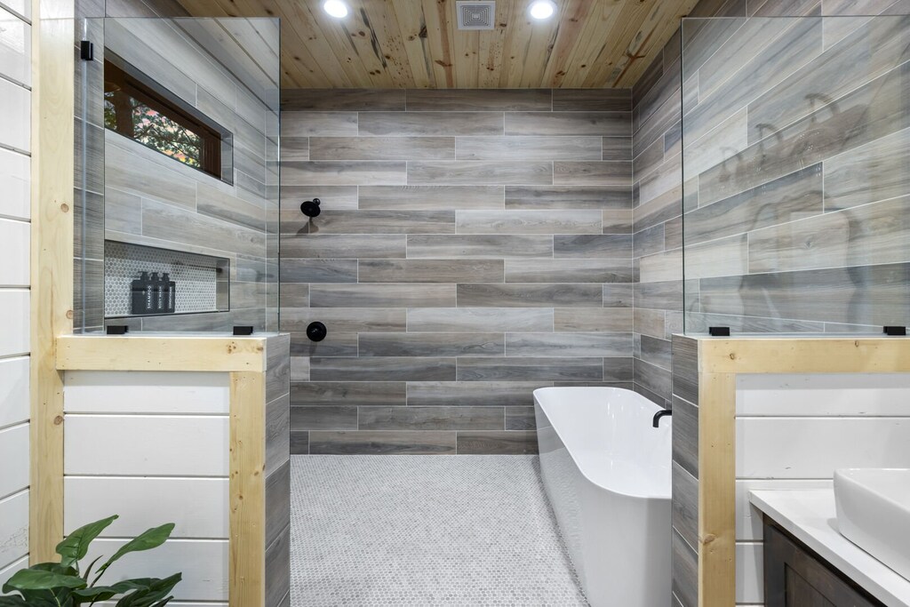 Large standing shower with soaking tub on other side