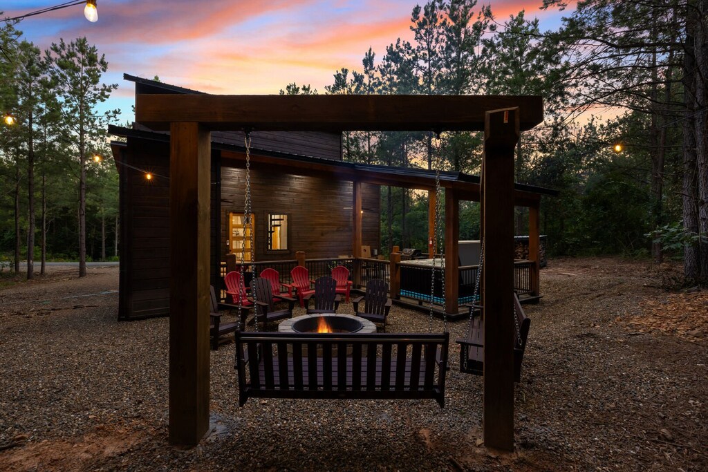 Large swing seating by fire pit as well