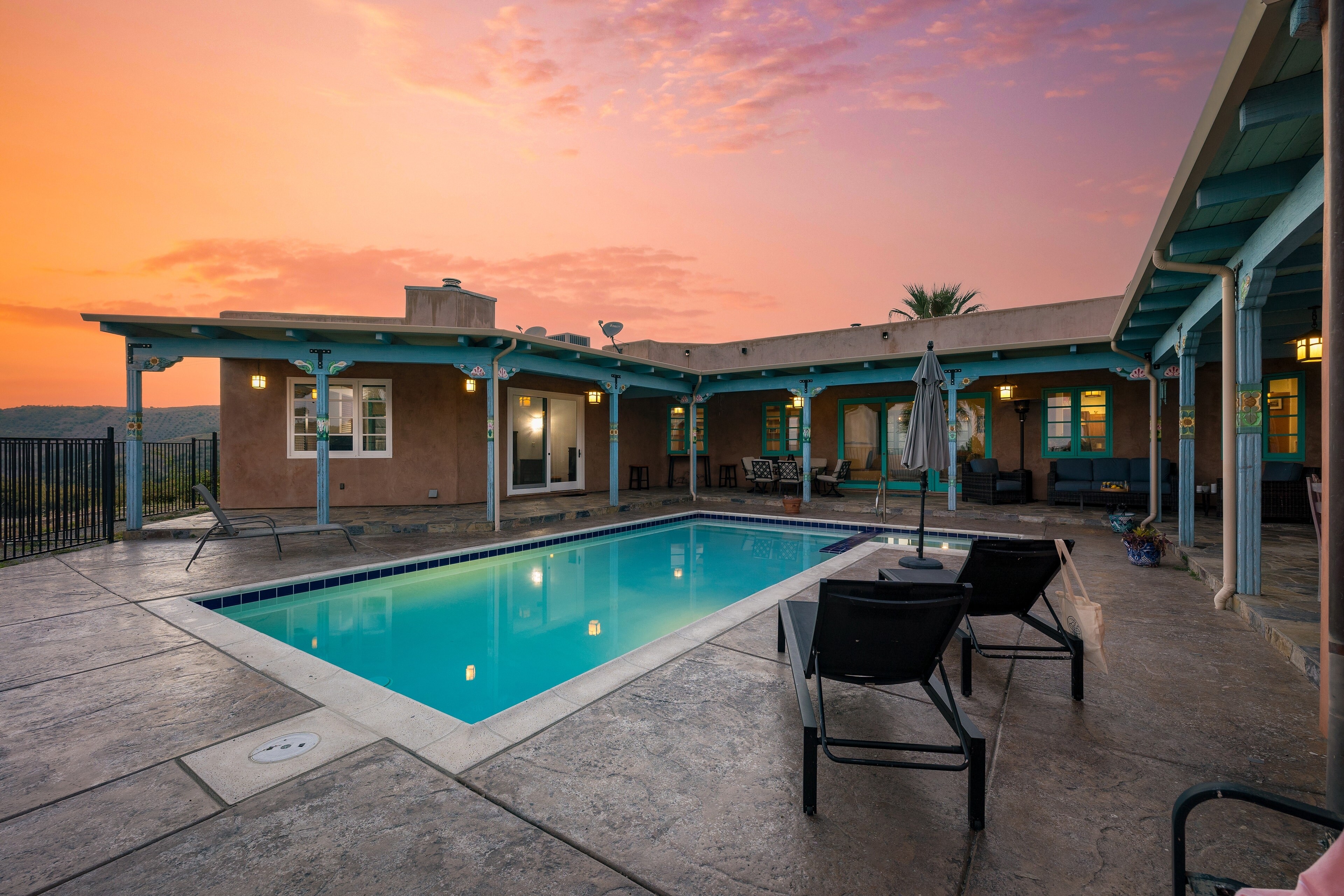 Outdoor paradise with a large pool and hot tub.