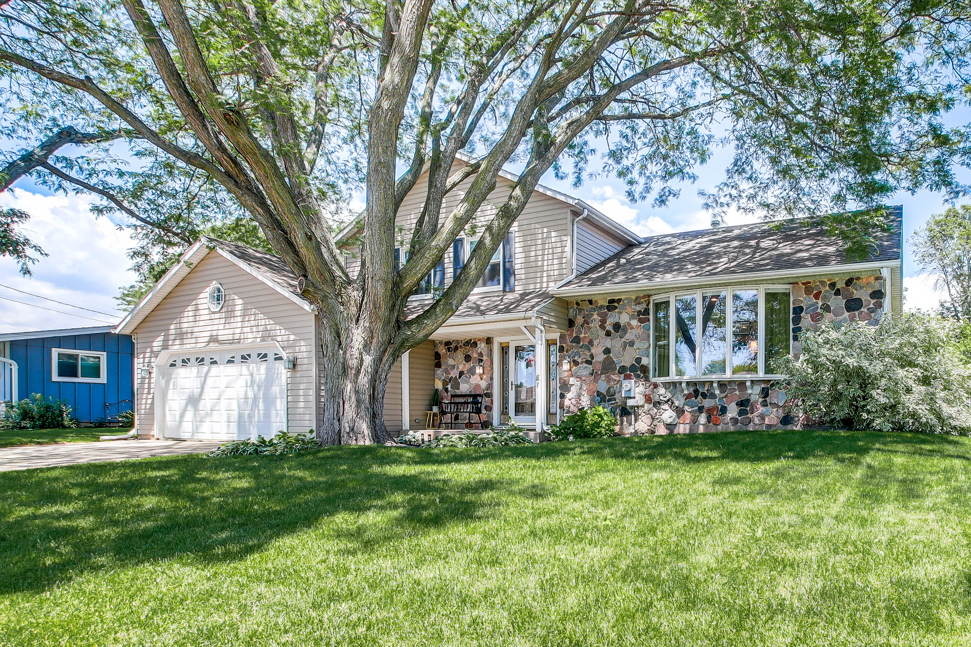 Property Image 2 - Oshkosh Canal-Front Home w/ Sunroom & Watercraft!