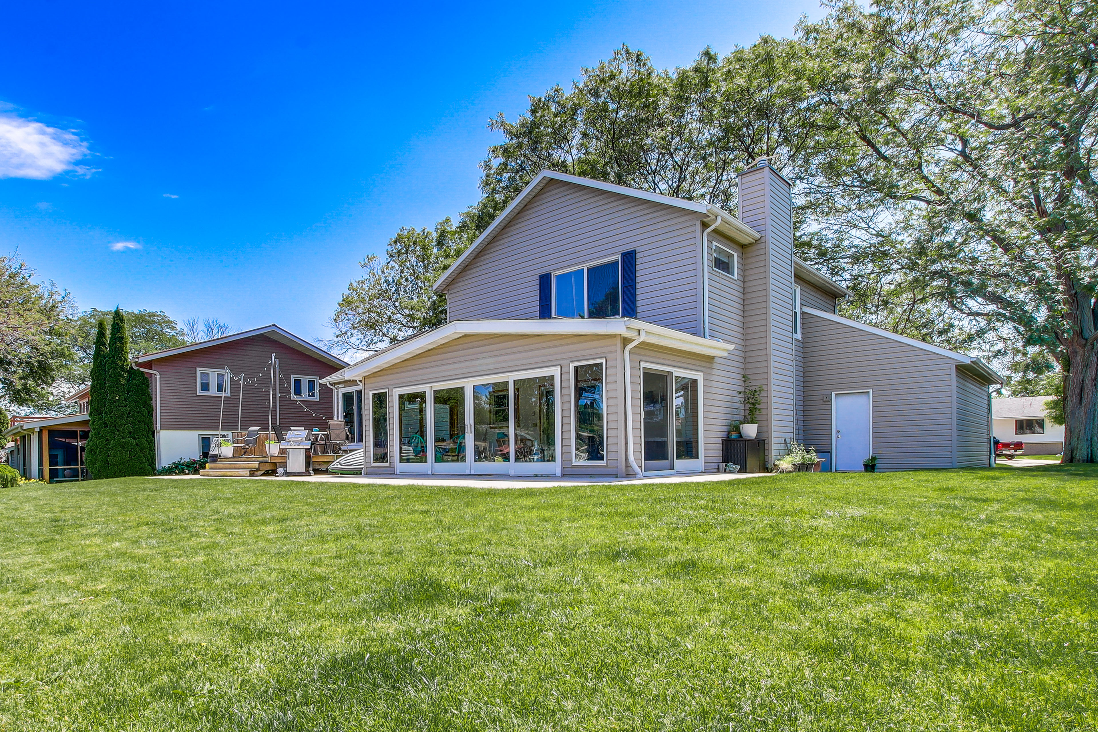 Property Image 1 - Oshkosh Canal-Front Home w/ Sunroom & Watercraft!